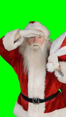 santa claus carrying gifts in sack