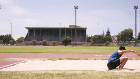 sportsman doing long jump