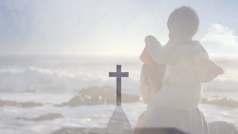 animation overlay of cross with child on adult's shoulders by ocean
