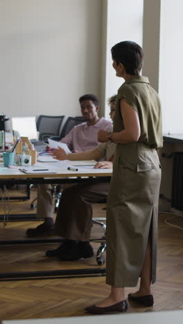 professional office meeting with diverse colleagues