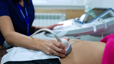woman is visiting a doctor at early stages of pregnancy. pregnant is having ultrasonic check up.