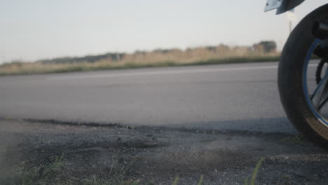 The-wheel-of-the-motorcycle-skids-through-gravel