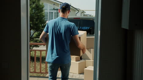 delivery person carrying boxes
