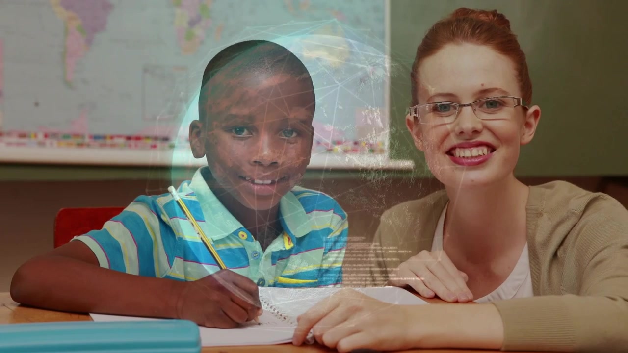 Woman leaning and pointing initiating tutoring, boy writing while globe overlay appearing, smiling