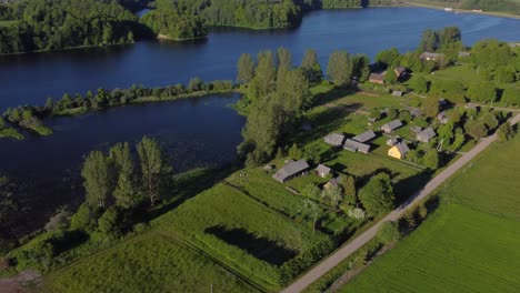 aerial orbiting shot of a small settlement in rural lithuania