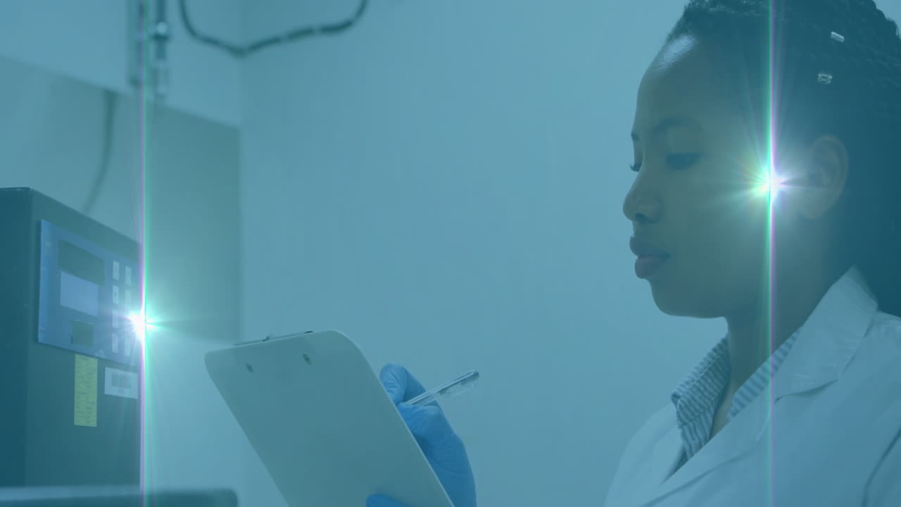In laboratory, scientist wearing gloves taking notes under blue lighting animation