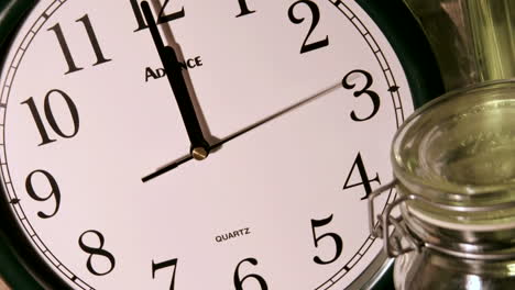 a second hand moves counterclockwise as minute and hour hands rapidly mark time on a clock face