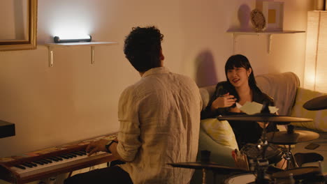 musicians performing music at home