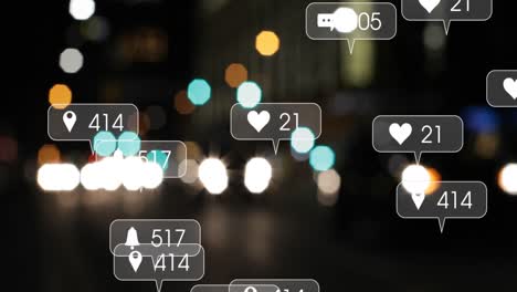 Animation-of-social-media-icons-and-numbers-over-out-of-focus-city-and-traffic-lights