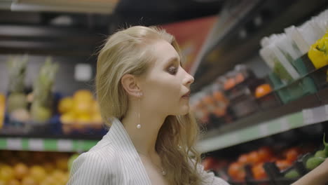 hands take few colorful pepper one by one in marketplace and hold. close up concept of selection buy quality fruit or red vegetables. young woman pick up some tasty freshness ingredient for cooking