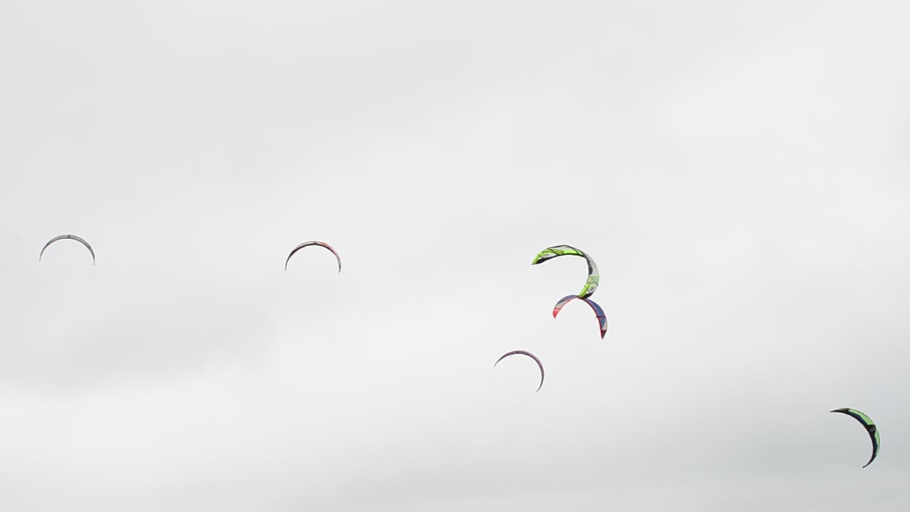 Driving on a board under a sail. Sea and wind
