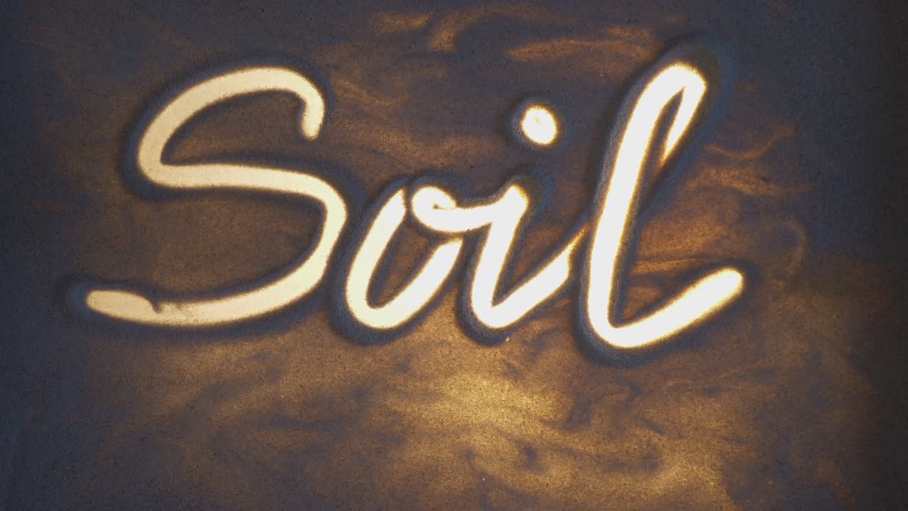 Soil Inscription. Sand On The Illuminated Glass