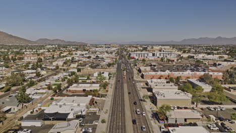 scottsdale arizona aerial v12 low flyover straight above north road across old town neighborhood capturing urban downtown cityscape of desert city at daytime - shot with mavic 3 cine - february 2022