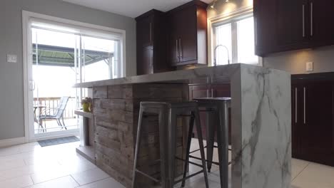 kitchen island with custom barn wood reveal slide from behind wall