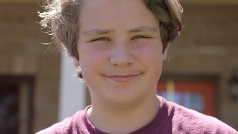 A-closeup-of-an-attractive-and-happy-teenage-boy-smiling-into-camera