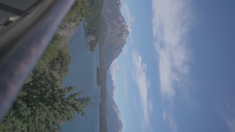 a view of a beautiful lake surrounded by mountains and forest in bariloche, patagonia, argentina