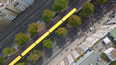 urban train smooth aerial top view flight csd pride love parade 2023 in city berlin germany summer day