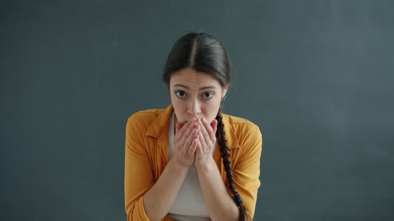 Woman expressing surprise and bowing