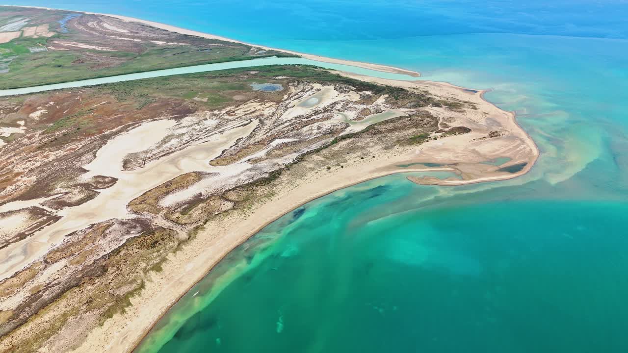 Aerial view of a serene coastal landscape with turquoise waters
