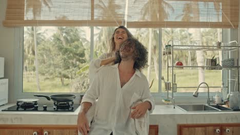 happy couple in a tropical kitchen