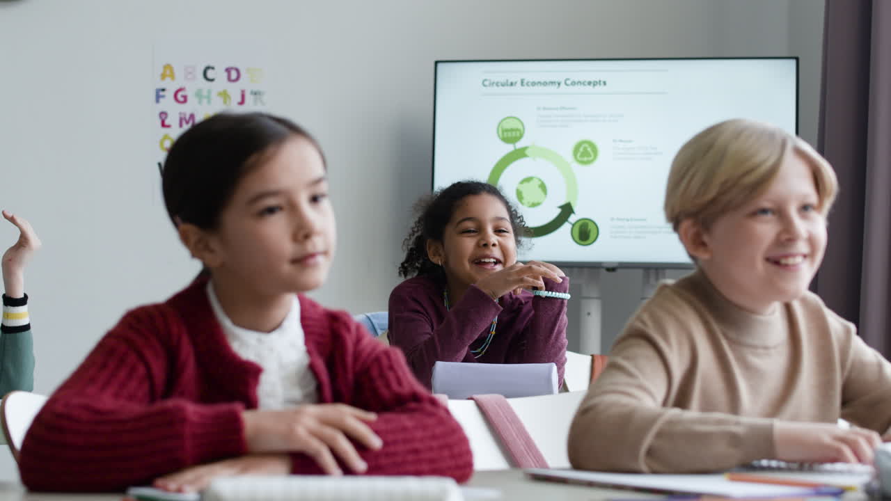 Children attentively listening to a presentation about circular economy