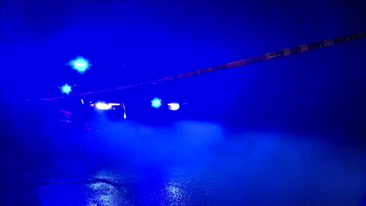 PORTLAND POLICE COP CAR IN THE FOGGY RAIN AT NIGHT WITH SIREN ON