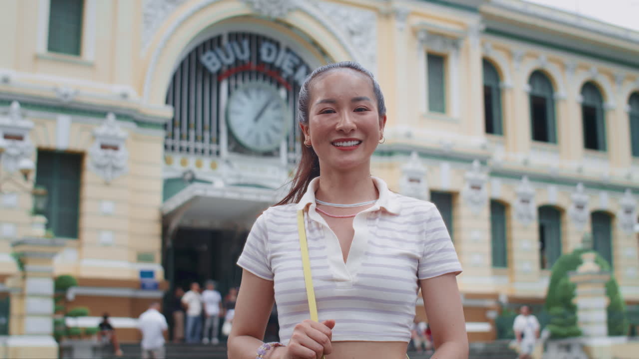 Portrait of Cheerful Asian Woman Walking in City Center