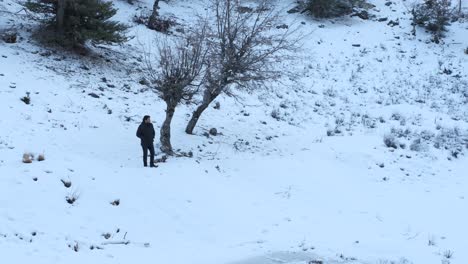 man standing in snow area