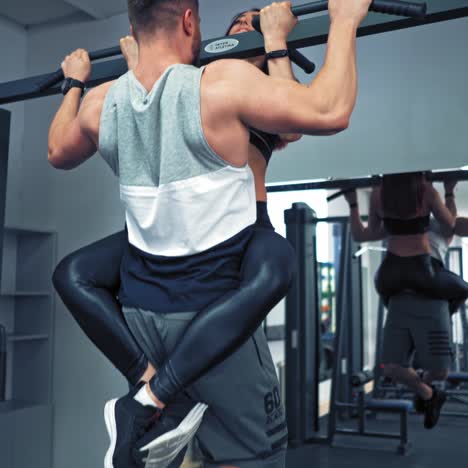 Young couple is working out at gym