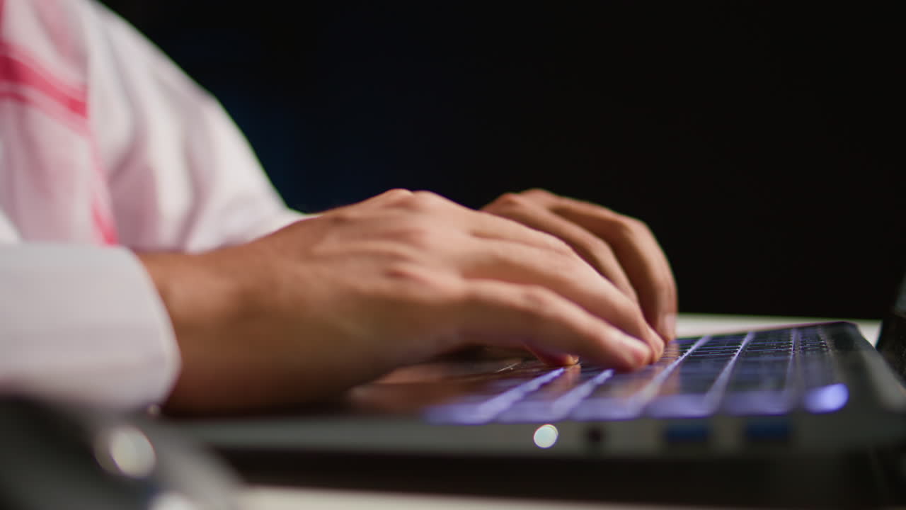Businessman typing on notepad keyboard