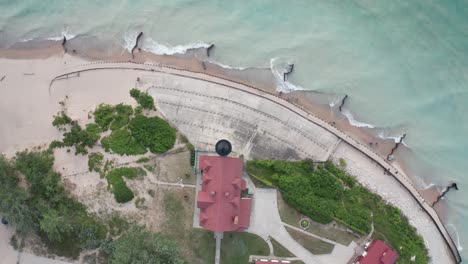 historic point betsie lighthouse in frankfort, michigan located along lake michigan with drone video overhead shot