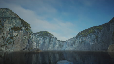 rocky cliffs in the ocean at sunny day