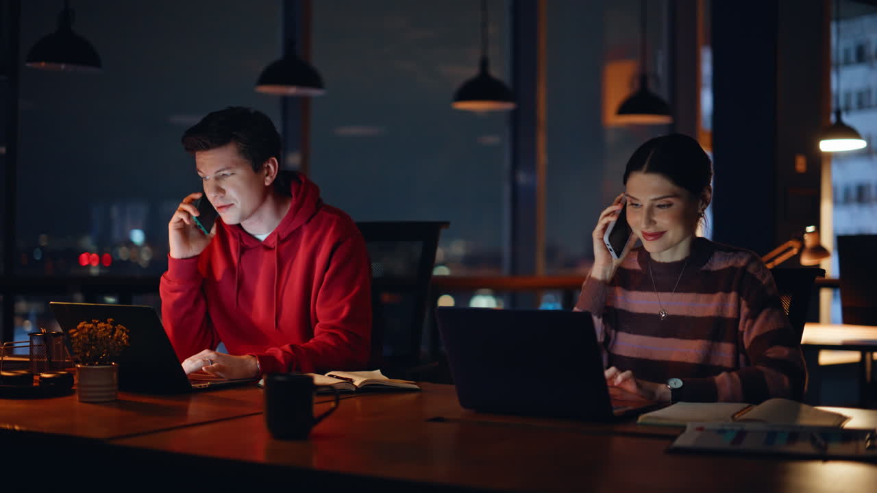 People working late in the office at night