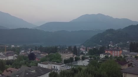 Aerial-reveal-type-clip-of-Levico-Terme,-Italy,-during-sunrise