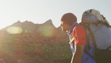 sporty mixed race man with prosthetic leg enjoy his hike