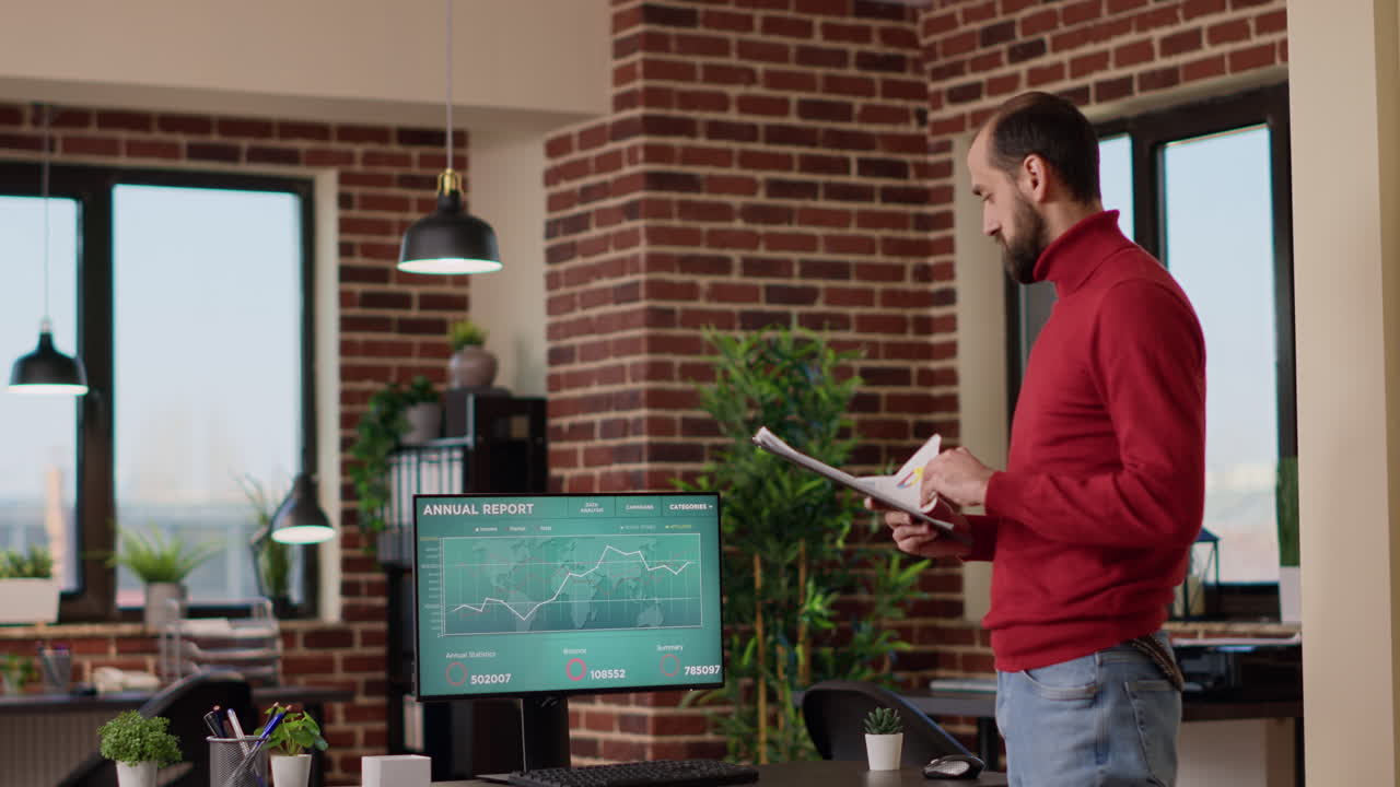 Young businessman using trade market profit data on screen