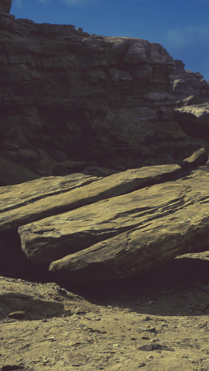 Unusual rock formation in a desert landscape under a clear blue sky