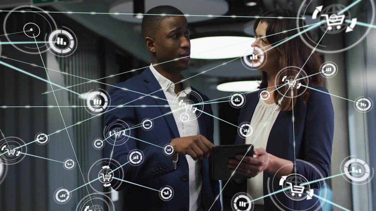 Two colleagues pointing, holding tablet in business, network expanding into charts, confirming deal
