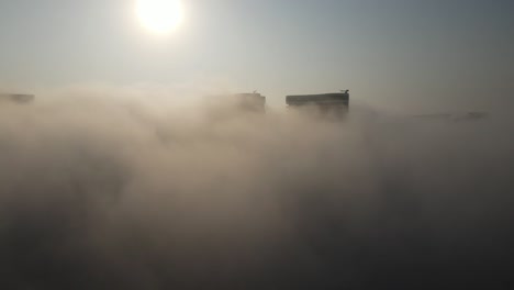 cityscape covered in morning fog