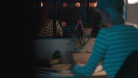 close up senior business woman working late sitting at desk writing mature female entrepreneur in home office workspace