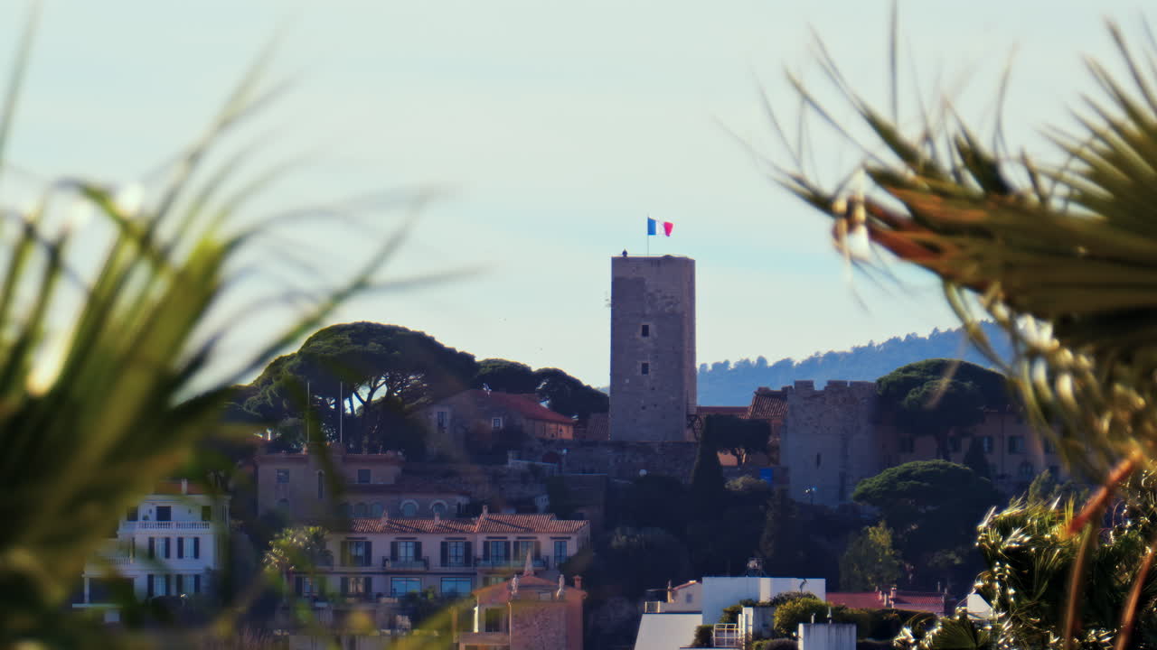 Distant view of the Goya Museum in Castres, France with the french flag on top of it