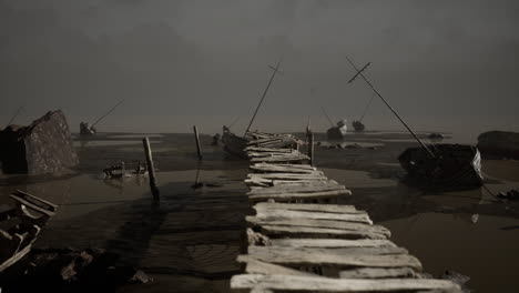 abandoned wooden pier leading to stranded boats in foggy landscape