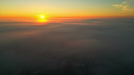 magical sunset with vibrant colors, aerial view above clouds