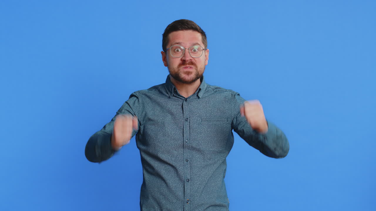 Amazed shocked excited mature man touching head and showing head explosion looking worried shocked