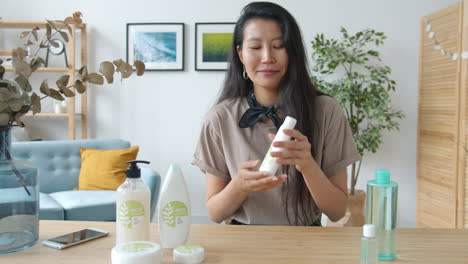 woman demonstrating eco-friendly skincare products