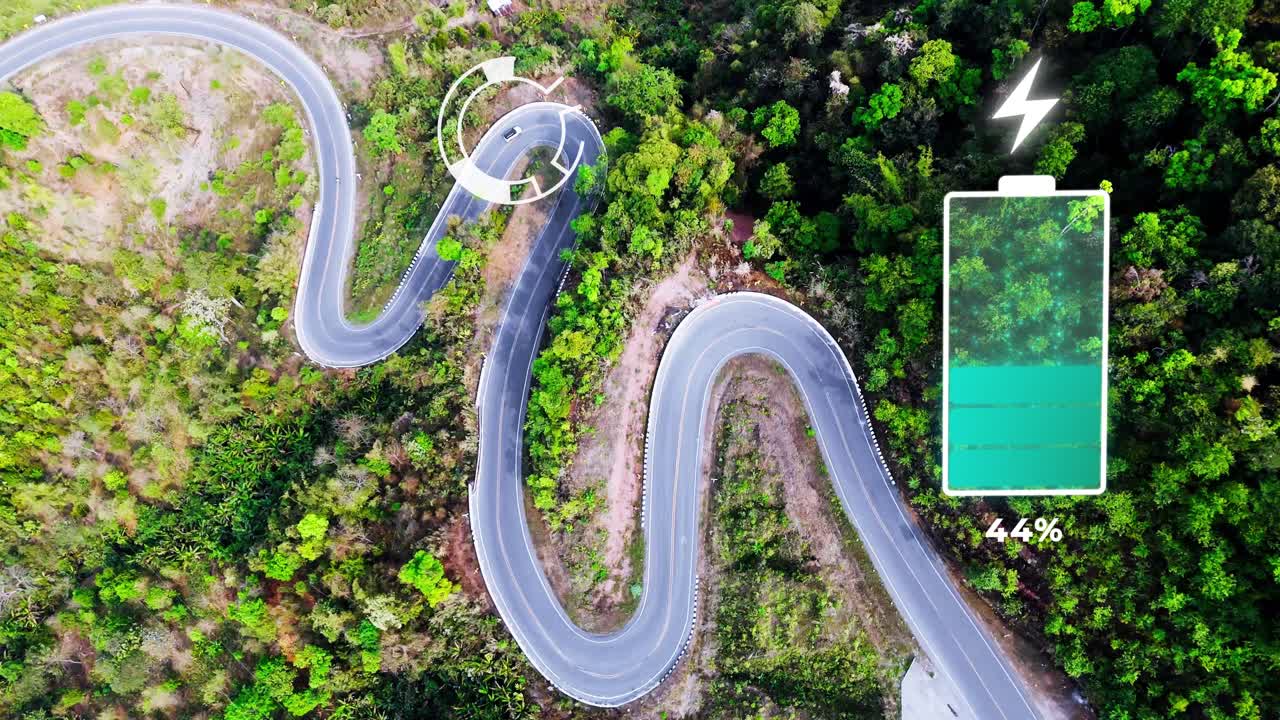 Aerial of electric car driving on bend road with green tree forest animation of battery charging