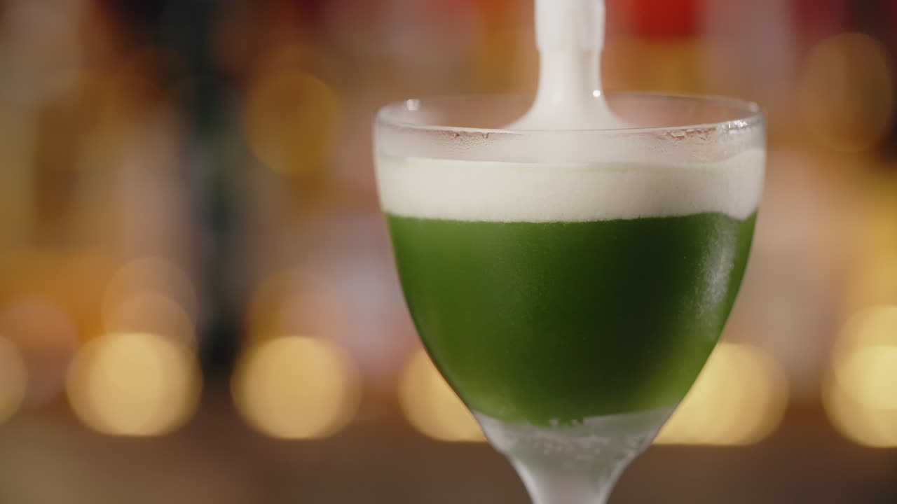 Green Cocktail with White Foam