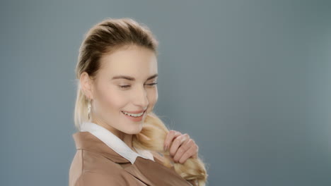 Smiling-business-woman-in-studio