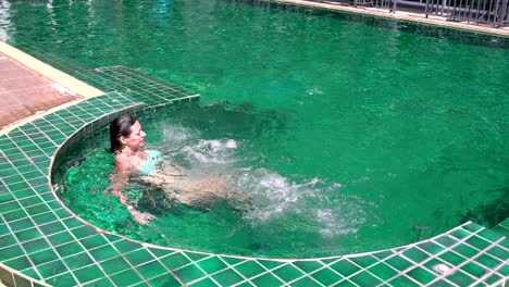 woman relaxing in the outdoor hot tub