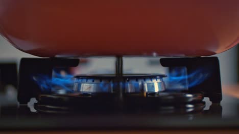 turn on the gas stove in manual slow motion.